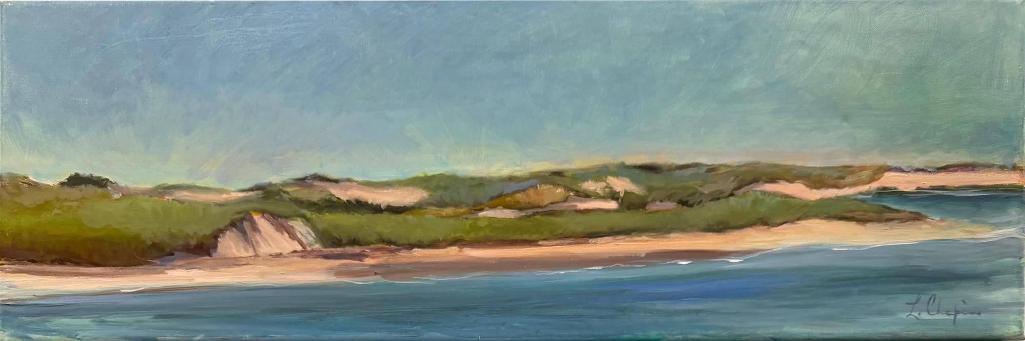 A long low band of green dunes and pale sand cliffs above an empty beach, painted across a narrow panoramic canvas under a soft grey-green sky. Oil painting by Lorraine Skelskey-Chapin, 10 by 30 inches.